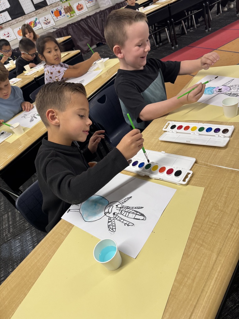 Students painting a turkey