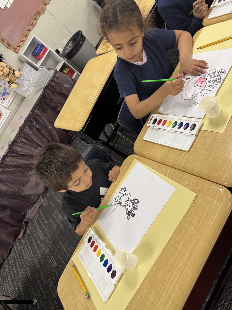 Students painting a turkey