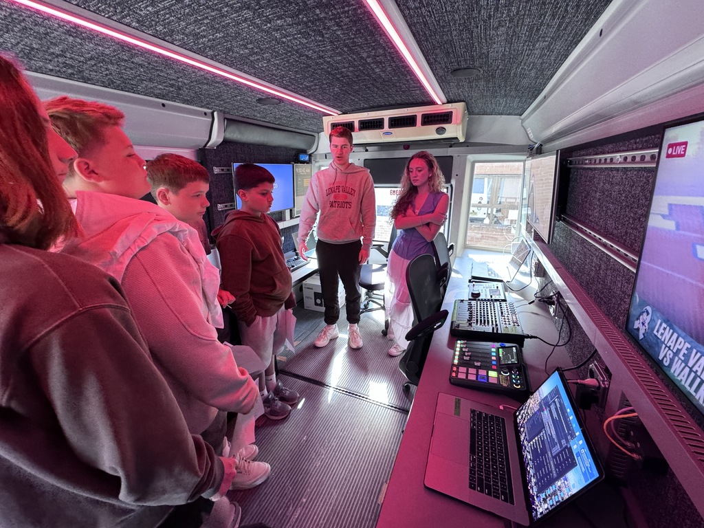 Michael Mariani and Isabella Pita giving students a tour of our new live-streaming production bus during  Byram’s Career Day.