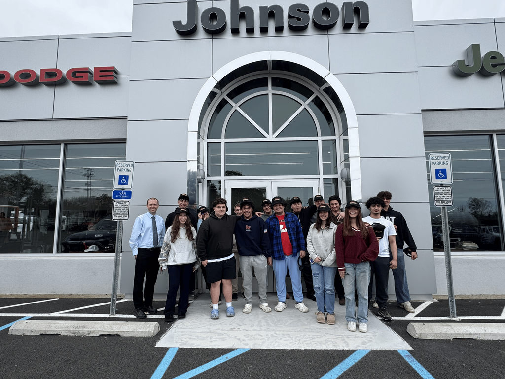 Photo with students and faculty/staff in front of Johnson Dodge in Mt. Olive NJ, from the Marketing I and II Field Trip.