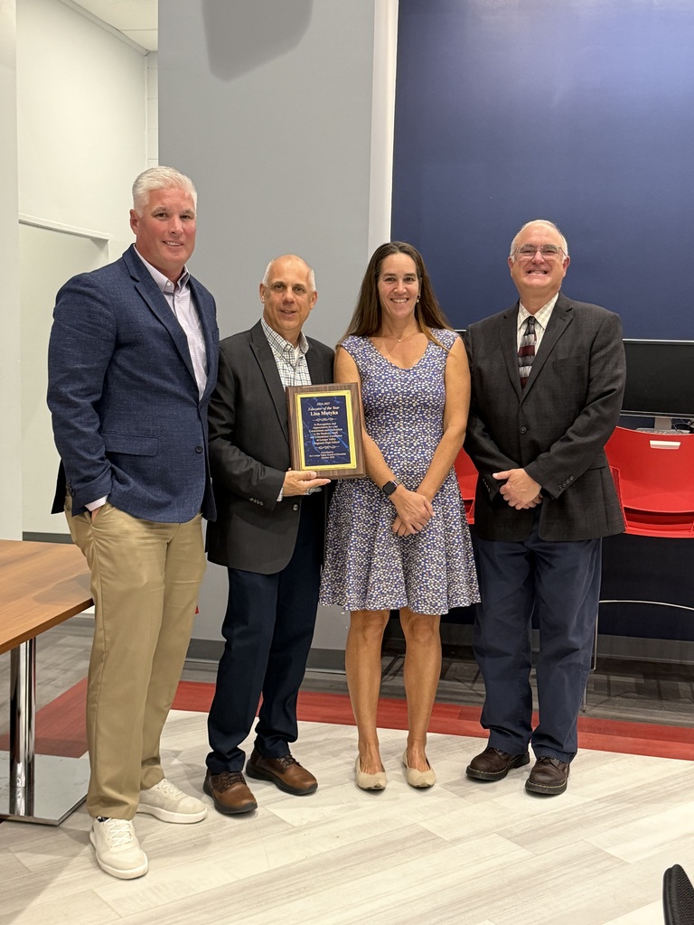 Lisa Motyka  poses with Mr. Reynolds, Mr. Kuncken, and Dr. Rossi and an award plaque as the Lenape Valley Board of Education honors her as the 2025–2026 Teacher of the Year.