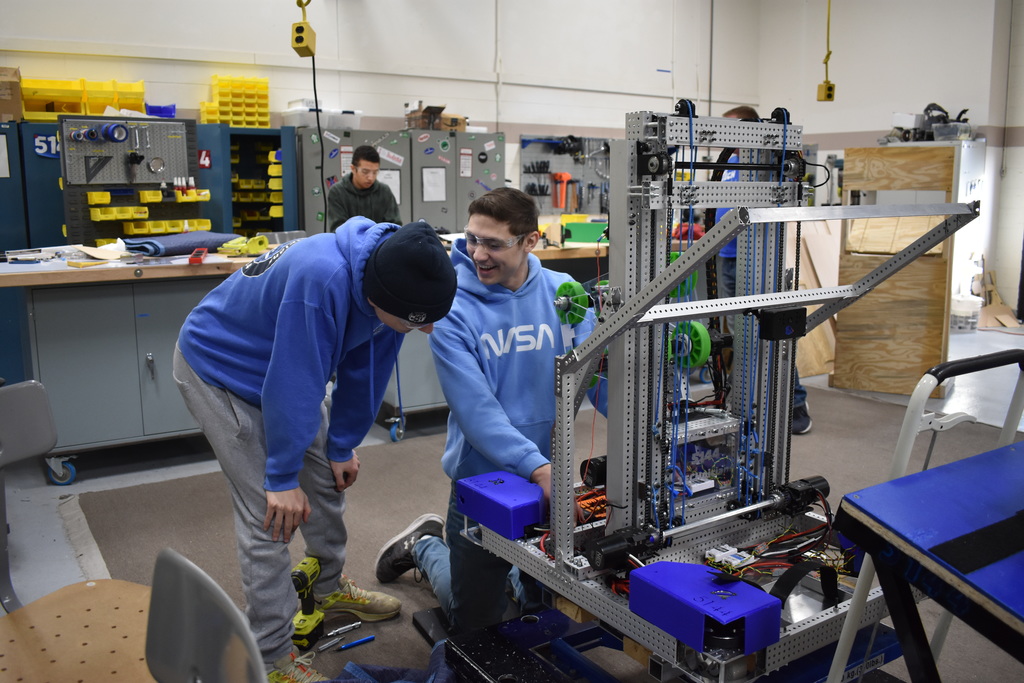 Two students working on their robot