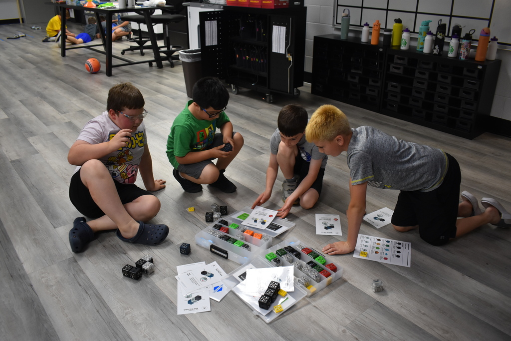 Students playing with robot game