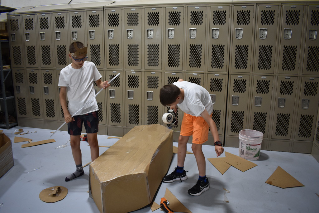 Students working on their boat