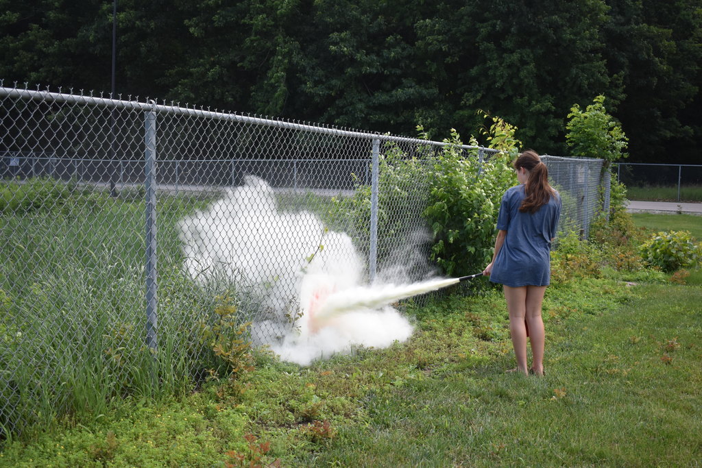 Student puts out a fire