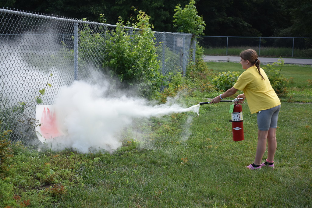 Student puts out a fire