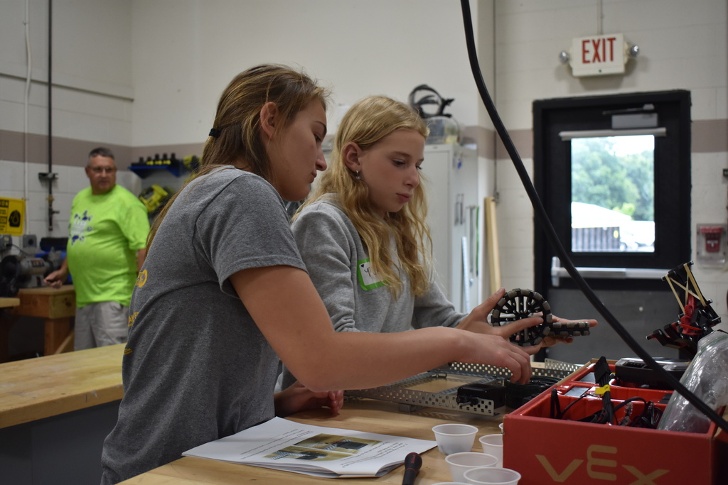 Two student building a robot