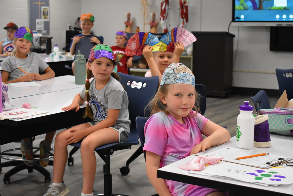 Students in brain hats