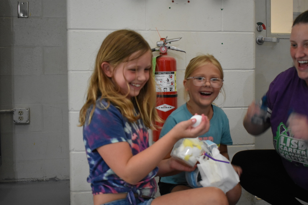Two students excited about their egg drop success