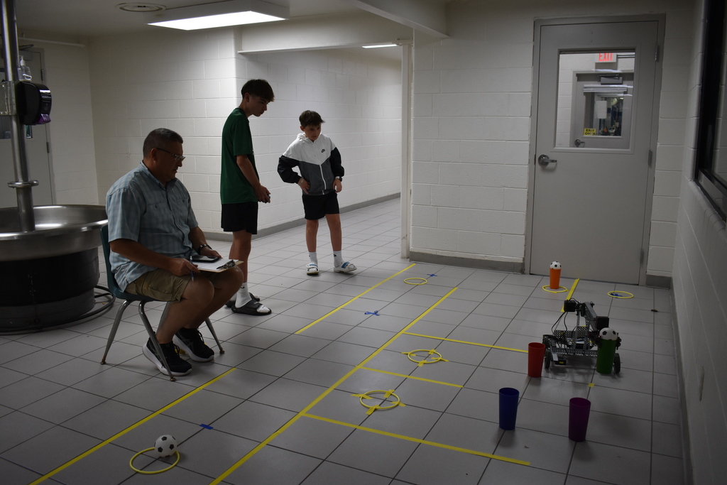 Student practicing with his robot