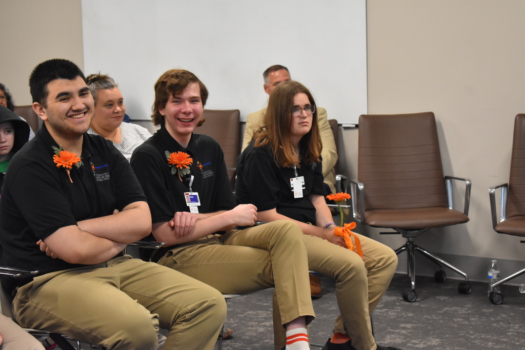 Students laughing as a reaction to something said