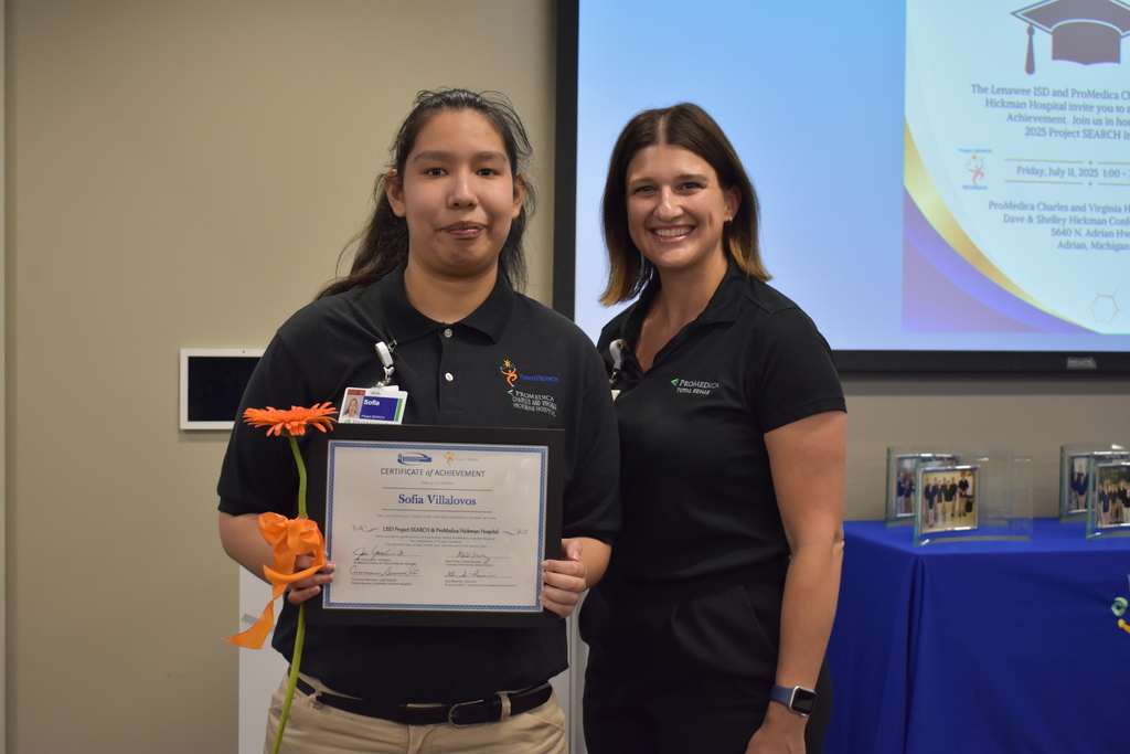 Student smiling with manager