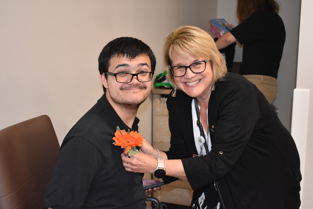 Student receiving his flower