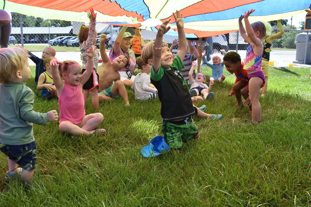 Kids under the parachute