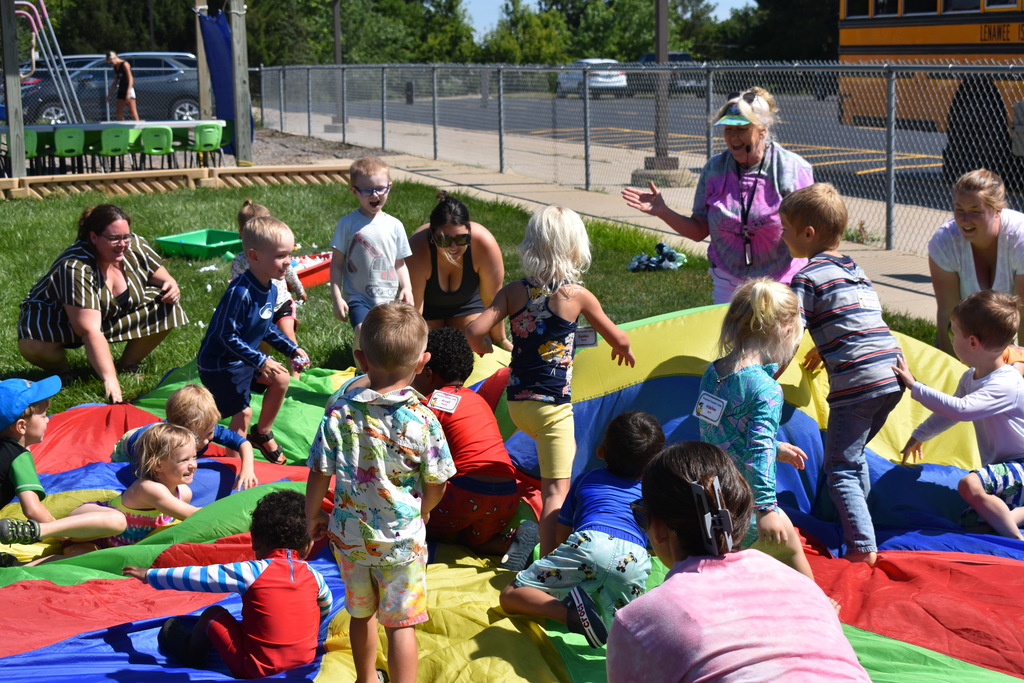 Kids climbing the mountain on the parachute