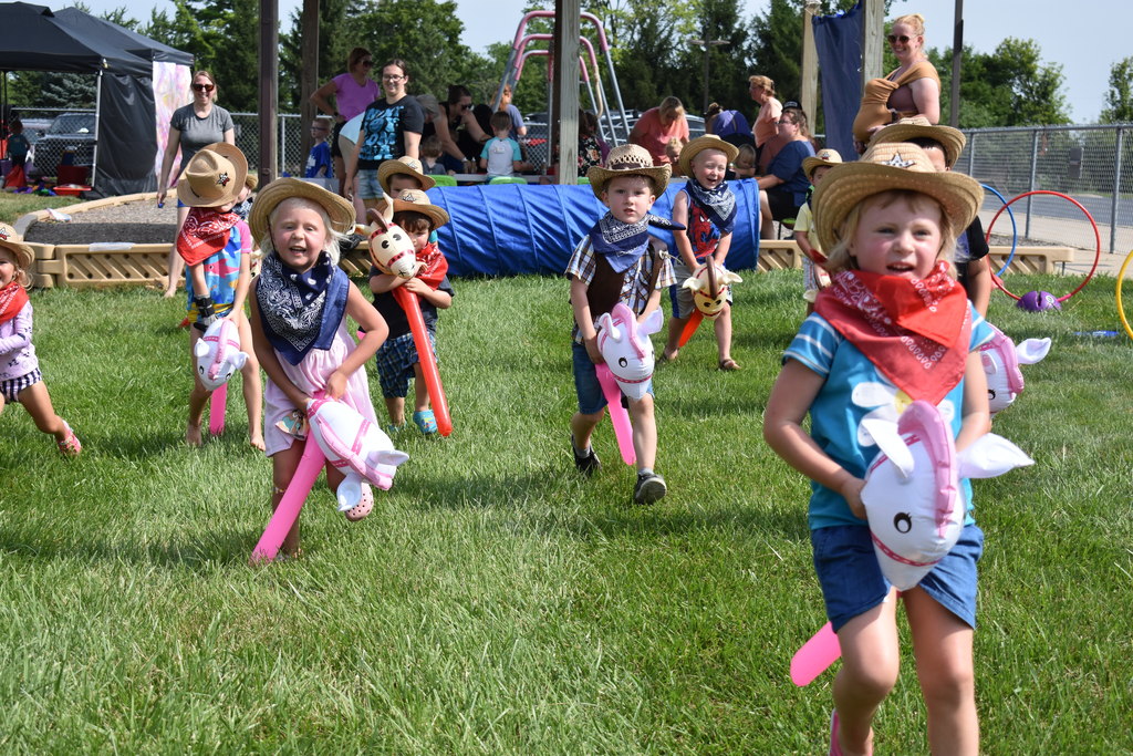 Little kids in giddy up race