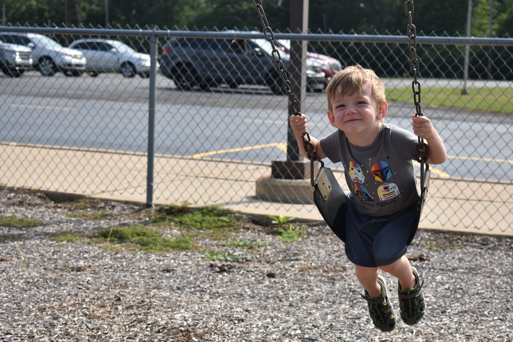 Little boy swinging