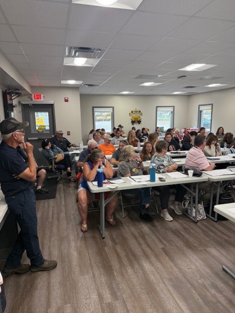Opening day meeting at the bus garage