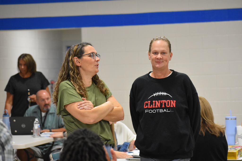 Two staff members chatting during the ice breaker
