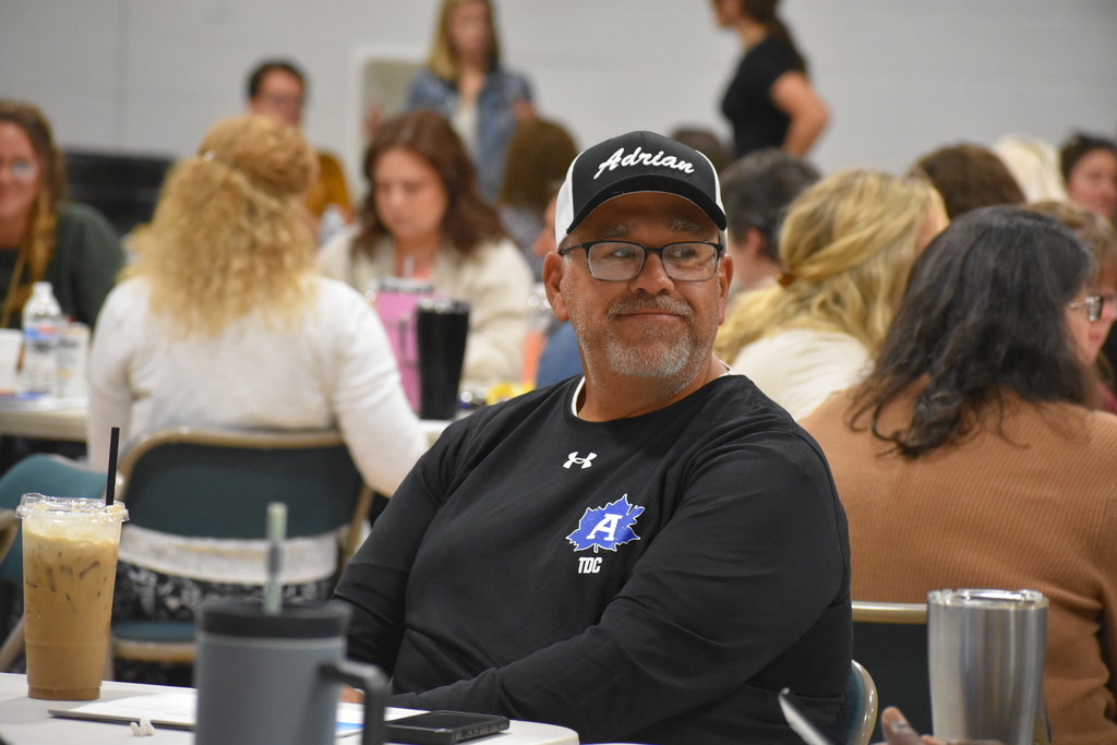 Staff member smiling at a colleague