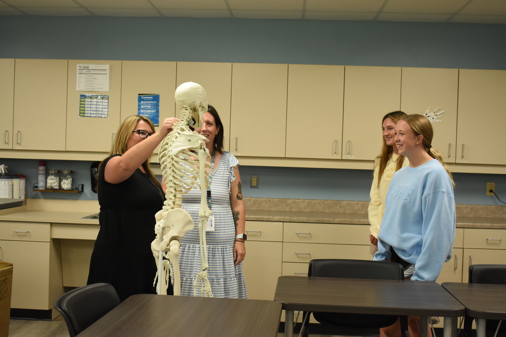 Instructors demonstrating for two students