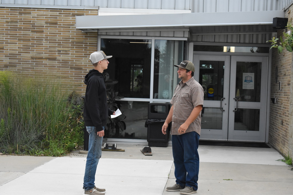 An instructor giving a tour to a student 