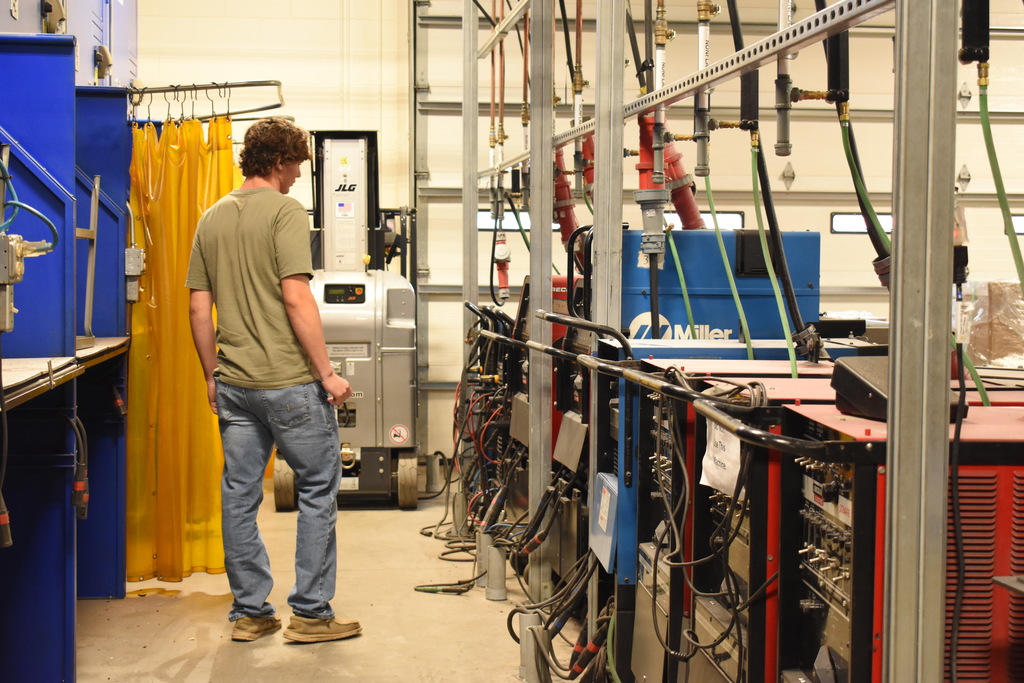 A student checking out the equipment he will be using