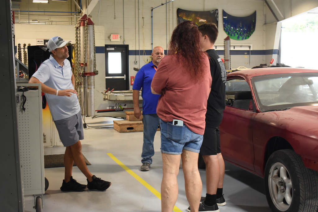 Instructors chatting with a family