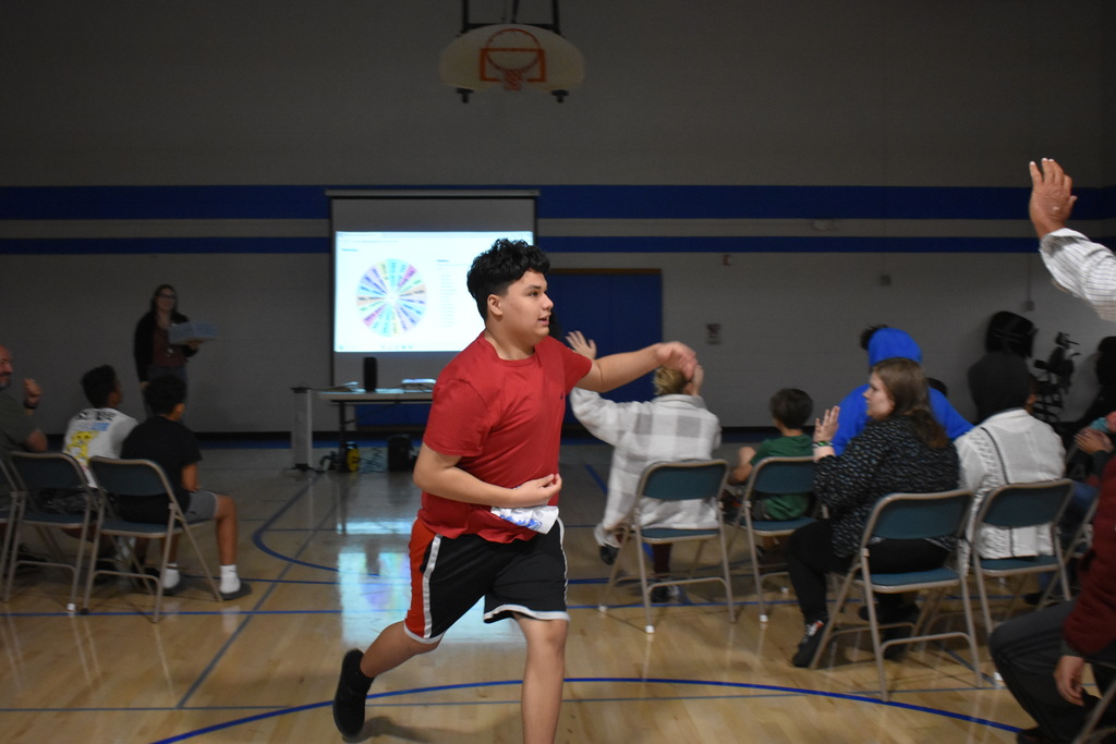 a student running to his new team