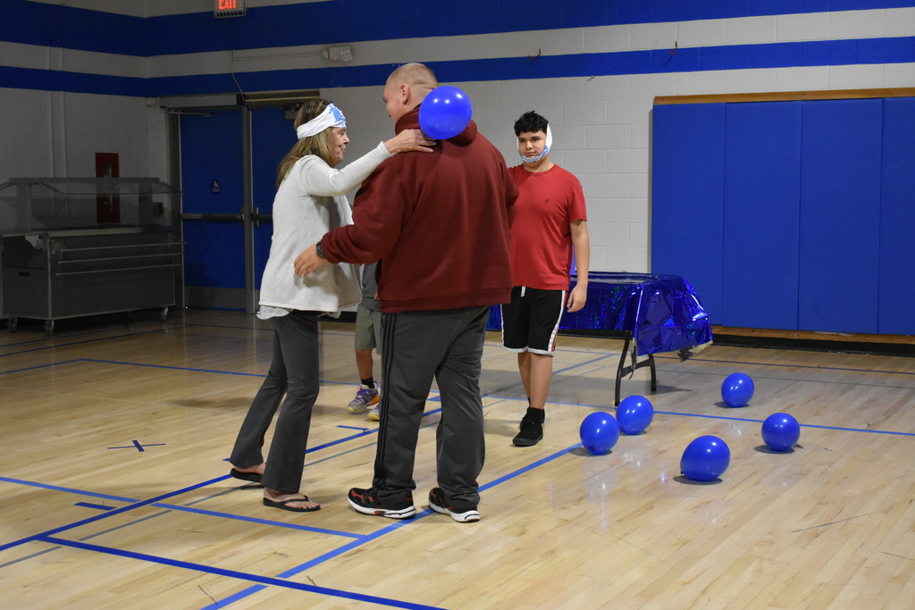 A team member being greeted by their instructor