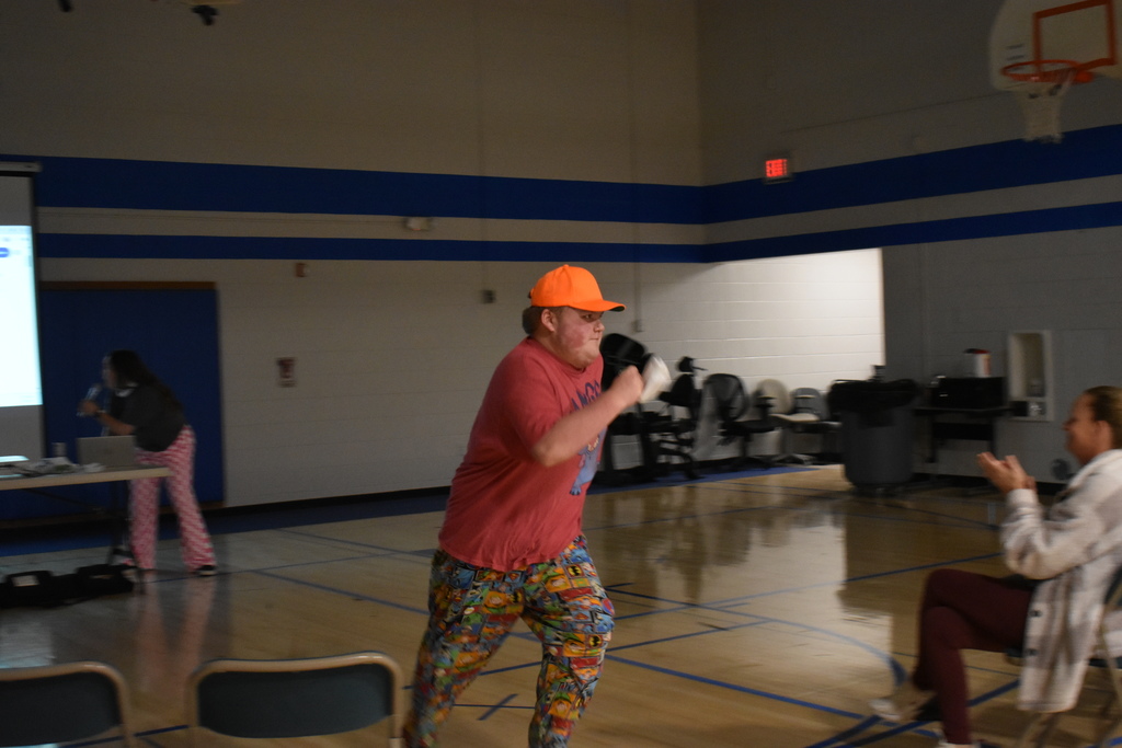 A student running to his team