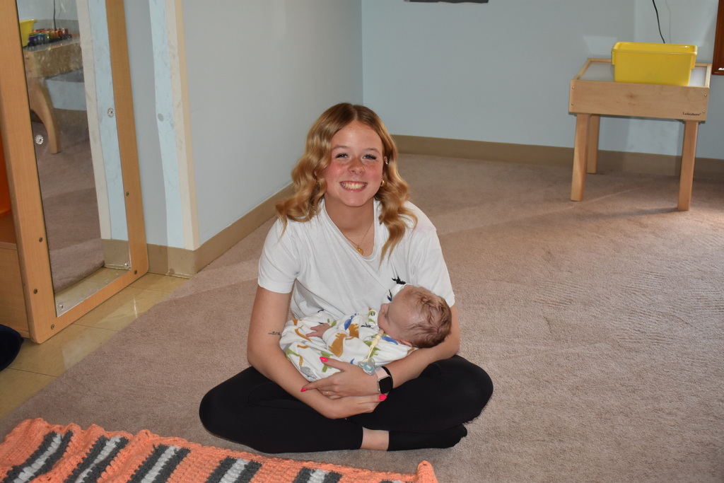 a student with her child during baby yoga