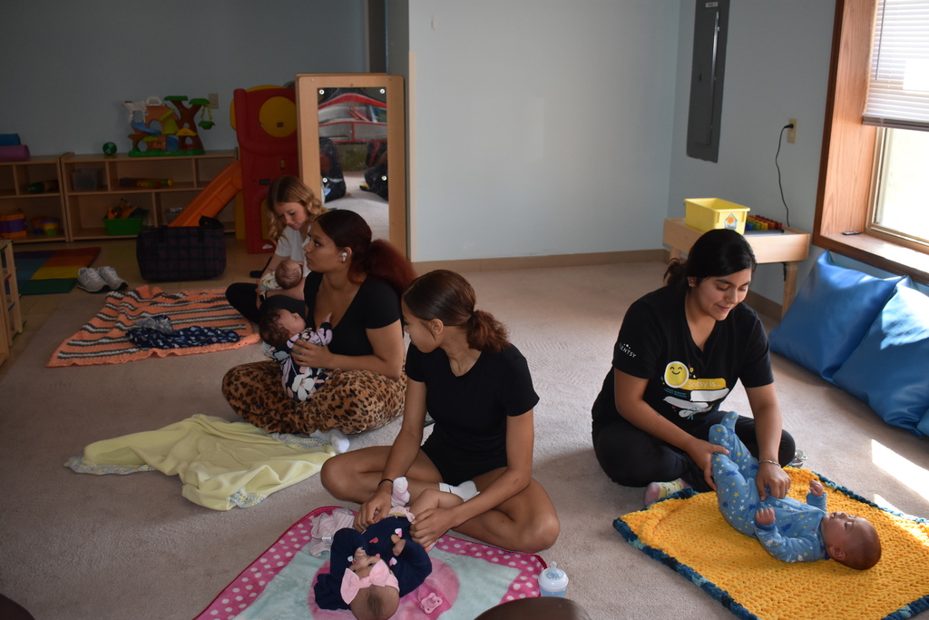 A group photo during baby yoga