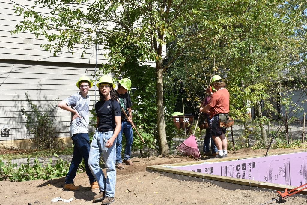Students working on the grounds around the building site