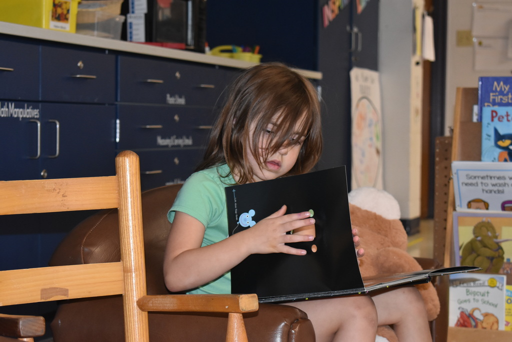 A student chooses to read during play time