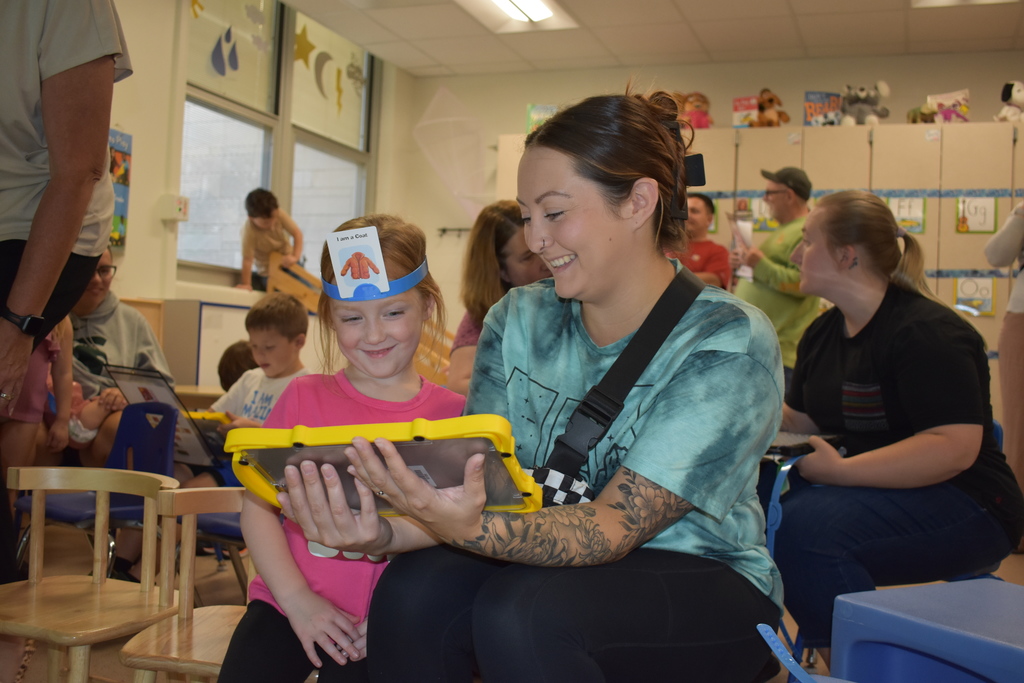 a parent and child playing a game together with LAMP language
