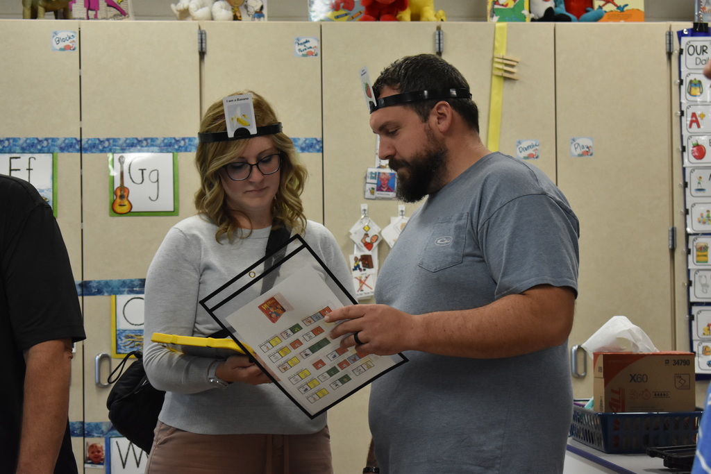 Two adults working with LAMP language