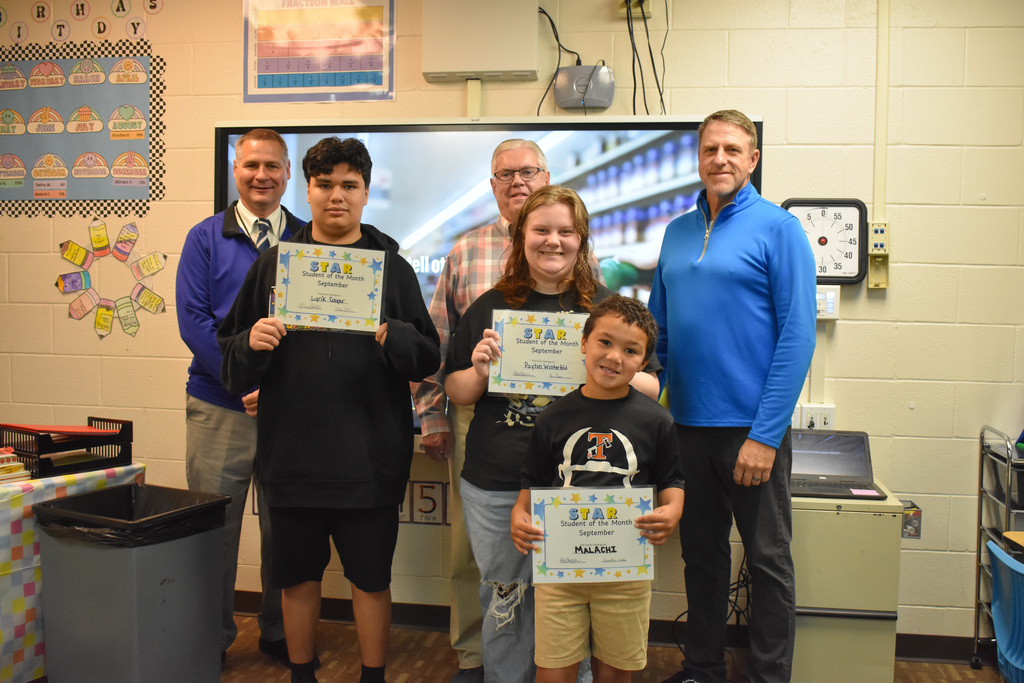 Board members with students of the month at Haviland