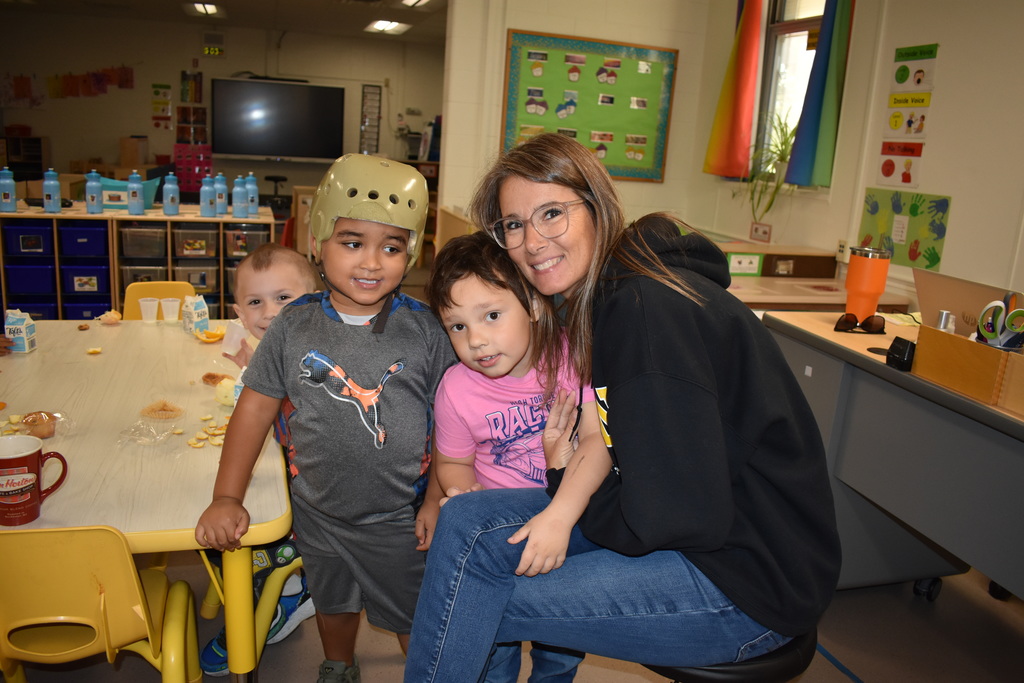 During the stop students pose for a photo with their teacher. 