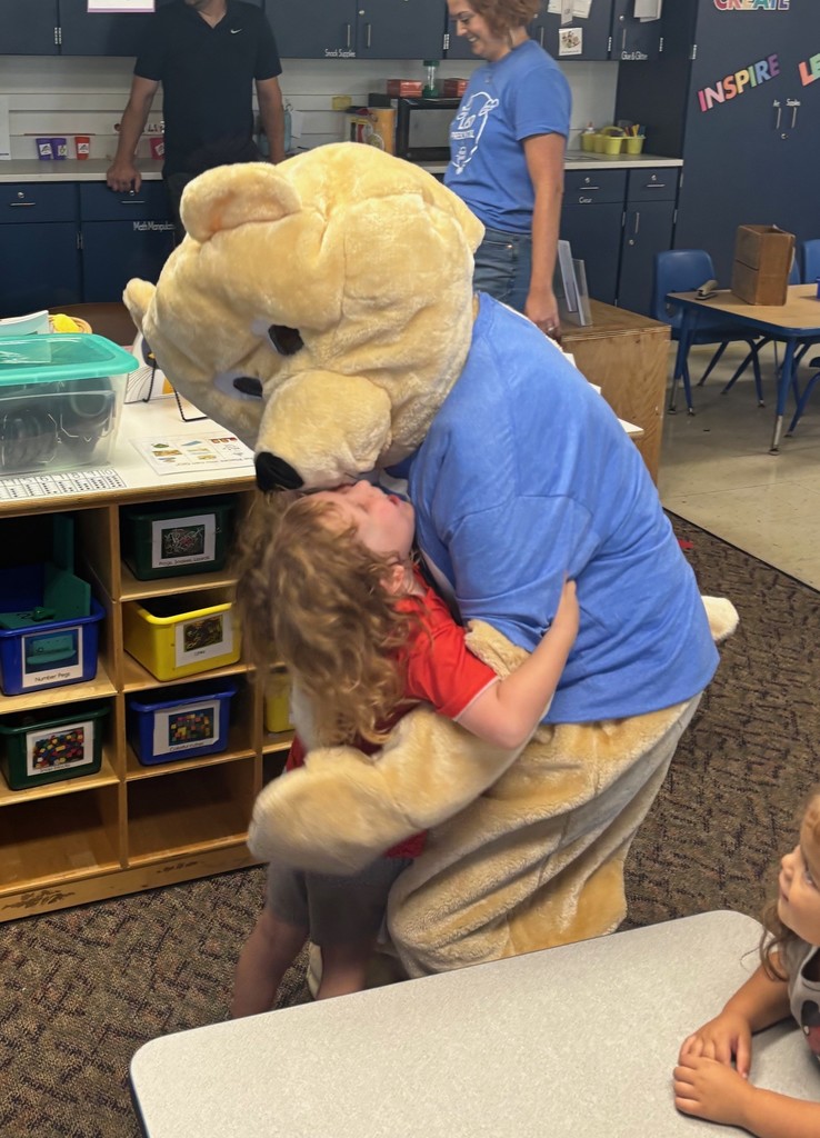 A student hugging Barry