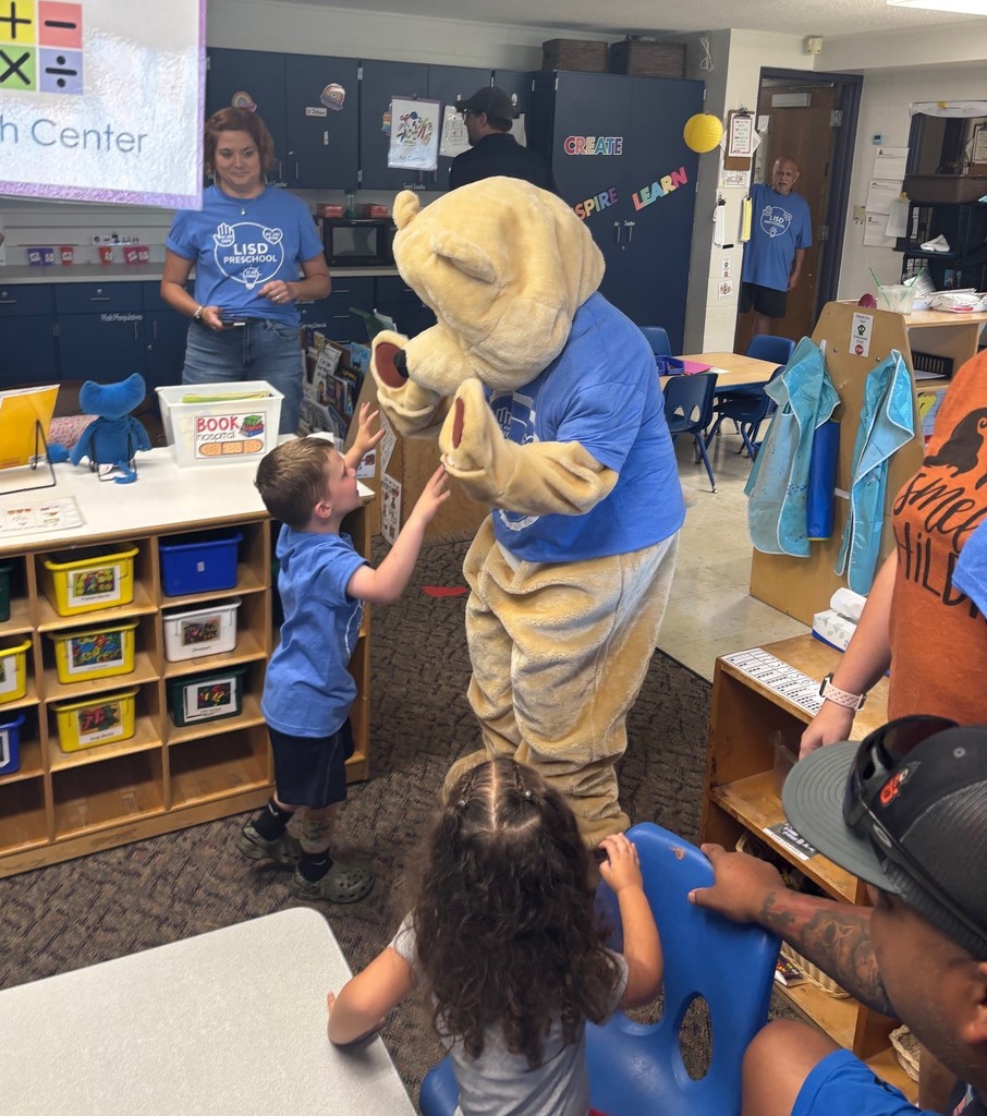 A student high fiving Barry