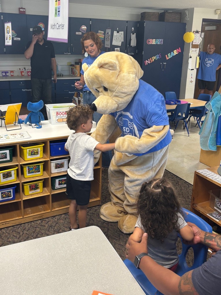 A student hugging Barry