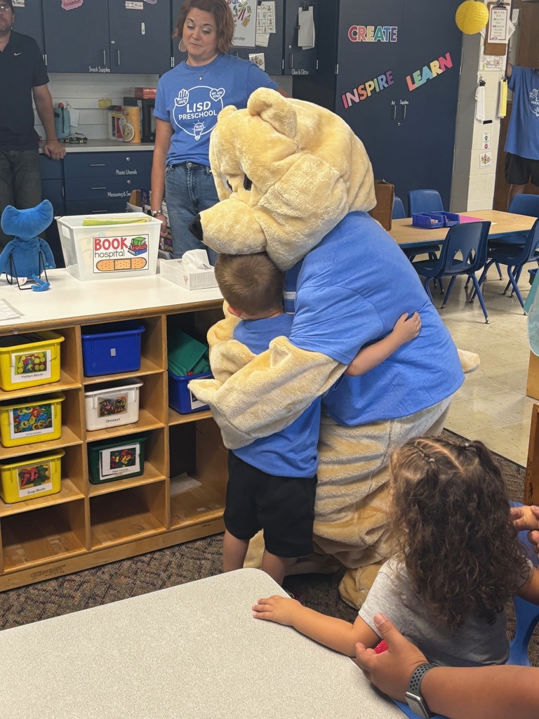 A student hugging Barry