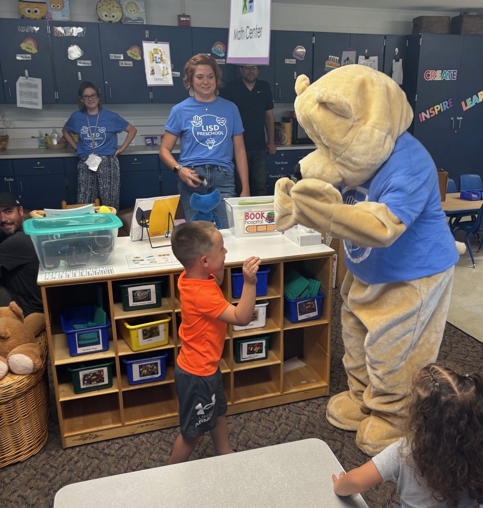A student high fiving Barry