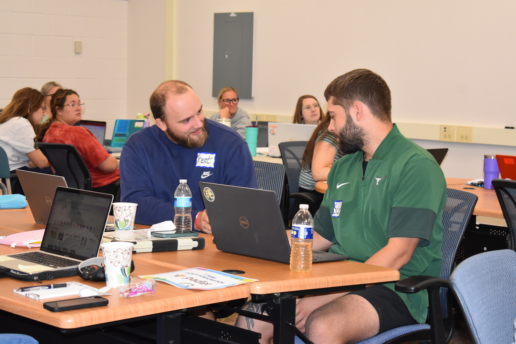 Two teachers chatting during the training