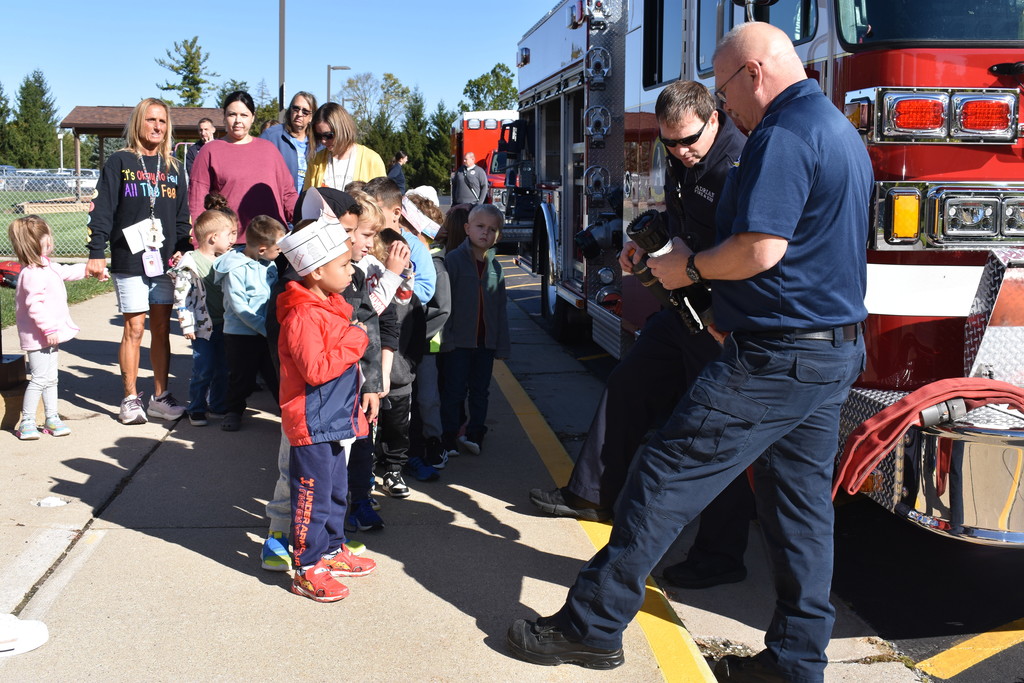 Students lined up ready to checkout the firehose 