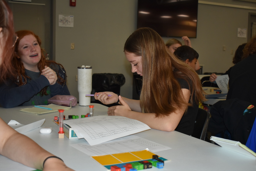 A student is privately calculating her move before making it