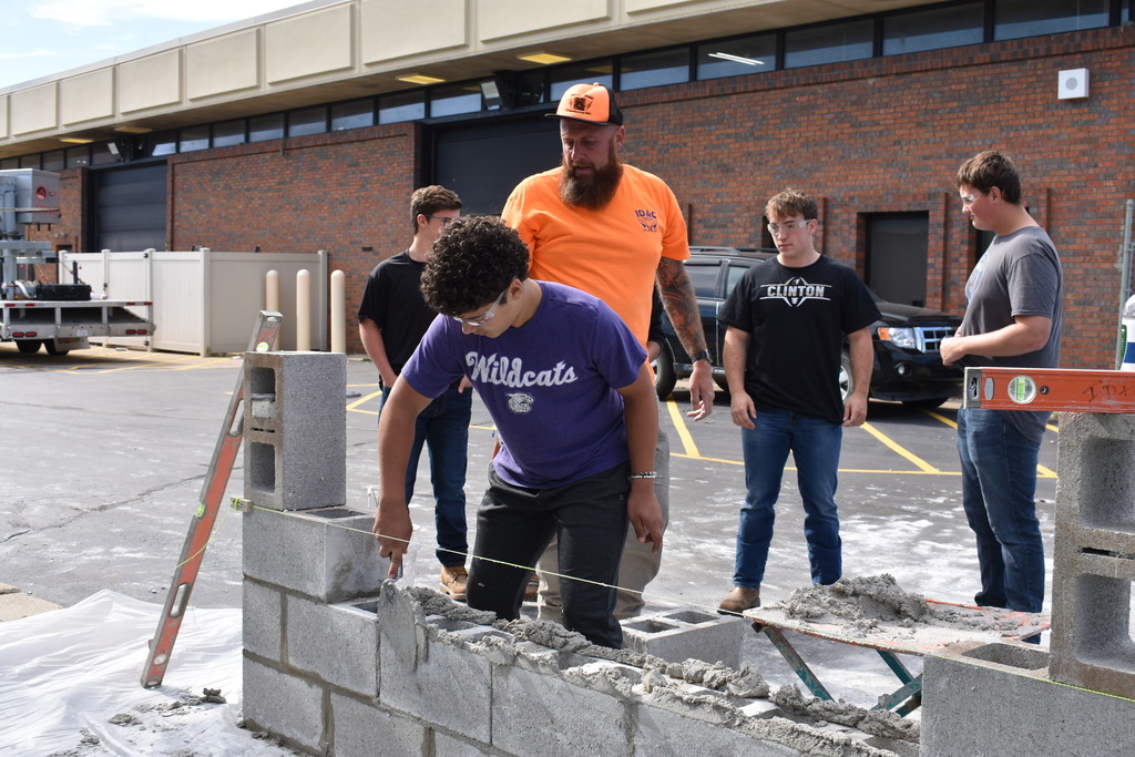 a student practicing with mortar