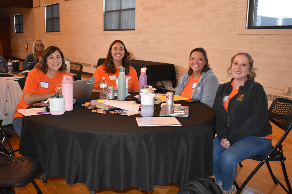 A literacy team working at a table