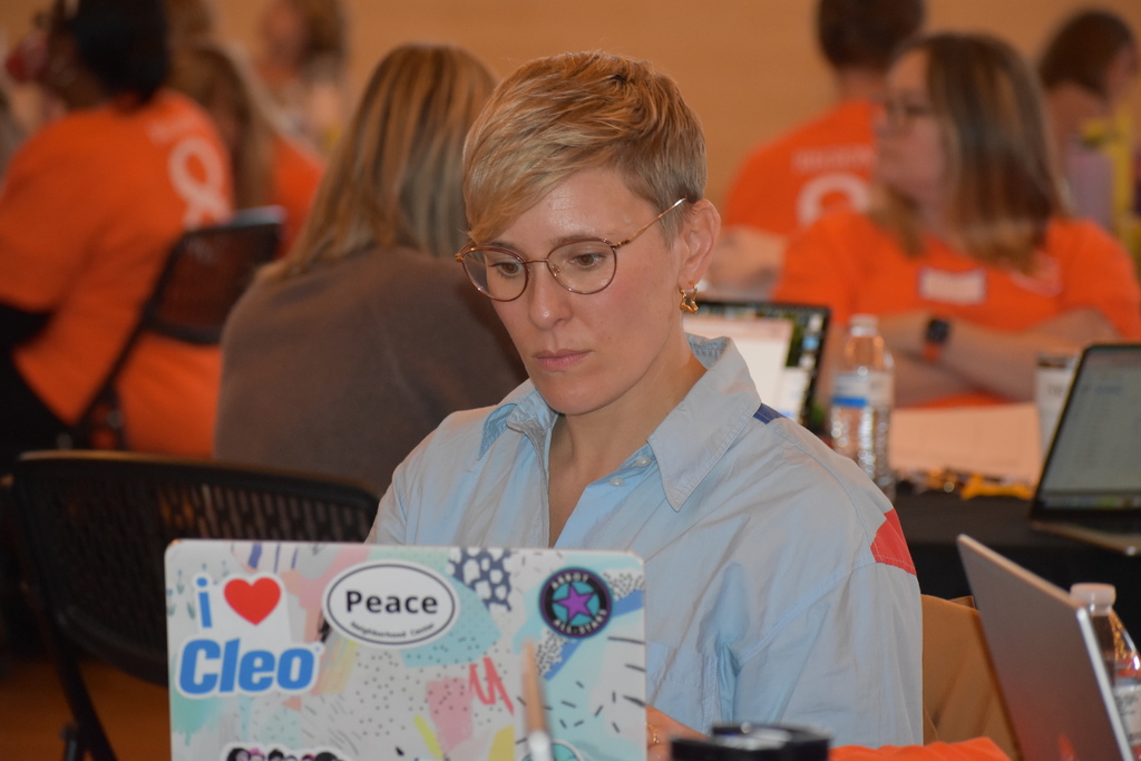 a coach working on her laptop